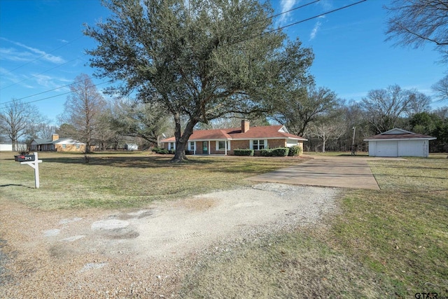 view of yard with an outdoor structure and a garage