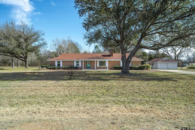 single story home with a garage and a front yard