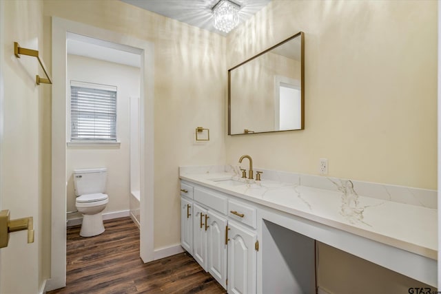 full bathroom featuring bathing tub / shower combination, vanity, toilet, a chandelier, and hardwood / wood-style flooring