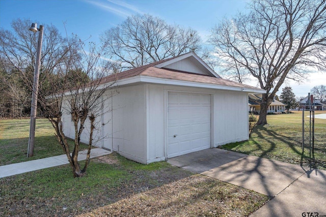 garage featuring a lawn