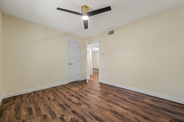 unfurnished room with ceiling fan and dark hardwood / wood-style floors