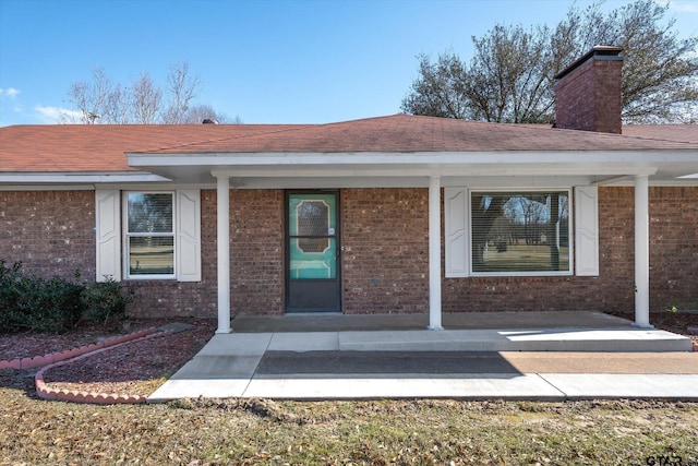 doorway to property with a porch