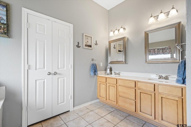 bathroom with tile patterned flooring and vanity