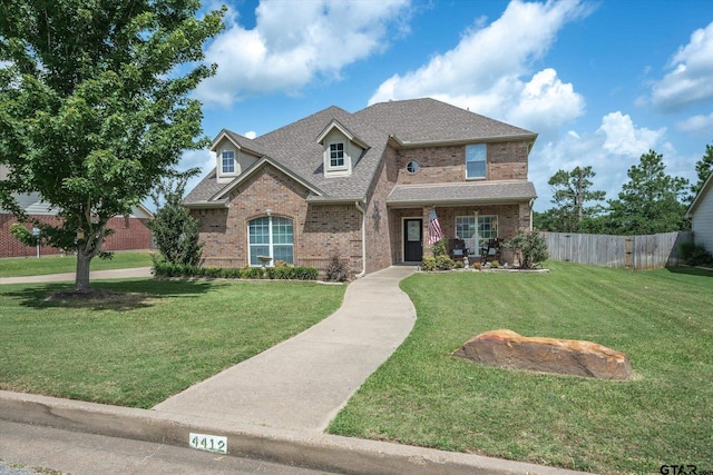 craftsman house with a front lawn