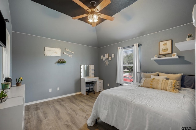 clothes washing area with cabinets, light tile patterned floors, and washer and clothes dryer