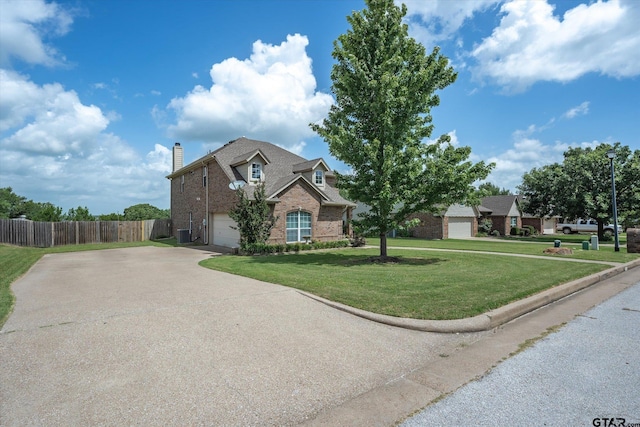 view of front of home featuring a front yard and a garage