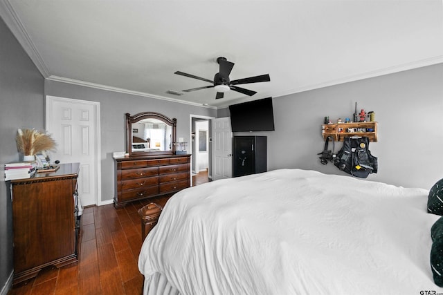 bedroom with dark wood-style flooring, crown molding, baseboards, and ceiling fan