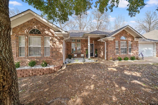 single story home with brick siding and an attached garage