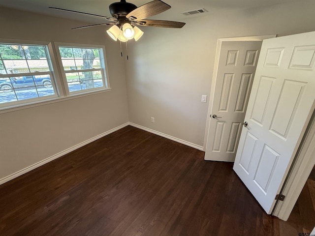 2533 Chelsea Dr, Tyler, TX 75701 - empty room featuring a ceiling fan and dark wood-type flooring