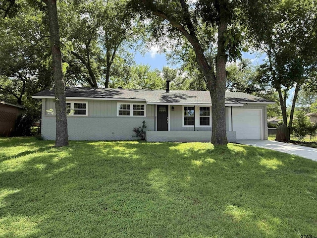 2533 Chelsea Dr, Tyler, TX 75701 - ranch-style house with an attached garage, brick siding, driveway, a front lawn, and roof with shingles