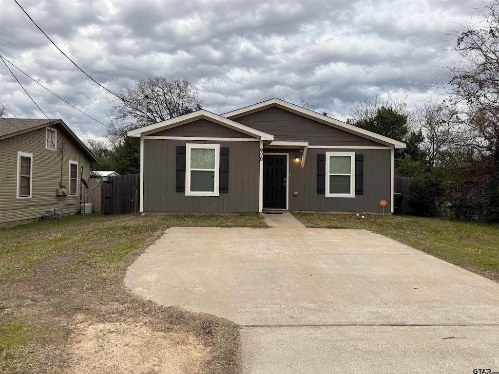 bungalow with a front lawn