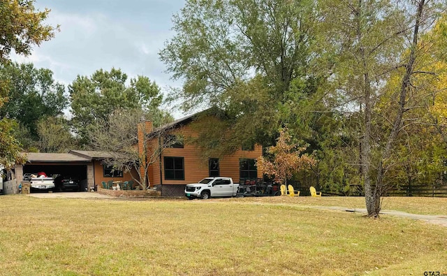 view of front of house featuring a garage and a front yard