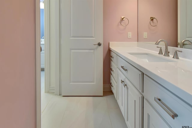 bathroom featuring tile patterned floors and vanity