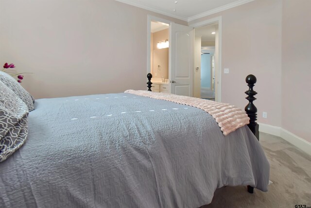 bedroom with ensuite bathroom, carpet, and ornamental molding