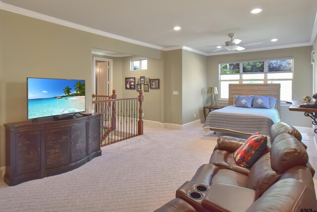 carpeted bedroom with ceiling fan and crown molding