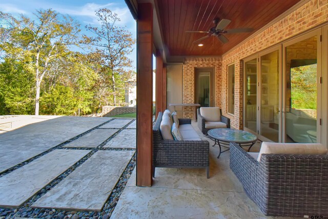 view of patio / terrace featuring ceiling fan and an outdoor living space