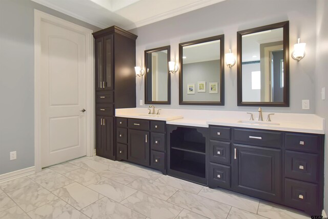 bathroom with vanity and ornamental molding