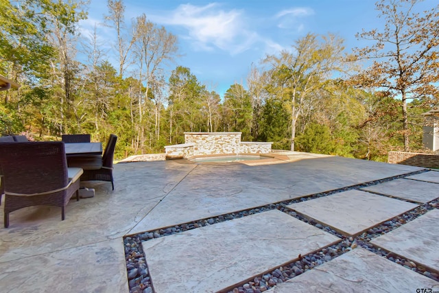 view of patio / terrace featuring outdoor lounge area and a pool