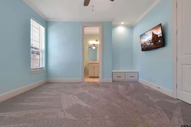 unfurnished bedroom with ensuite bathroom, crown molding, ceiling fan, and light colored carpet