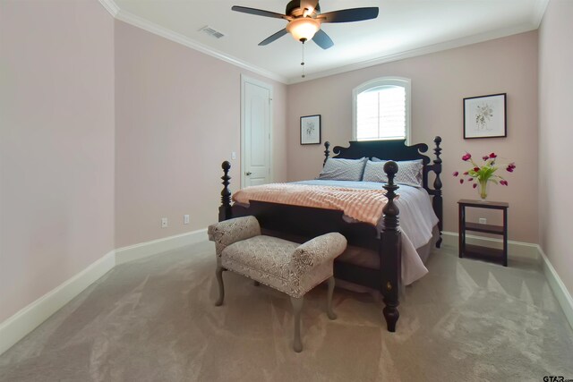 carpeted bedroom featuring ceiling fan and ornamental molding