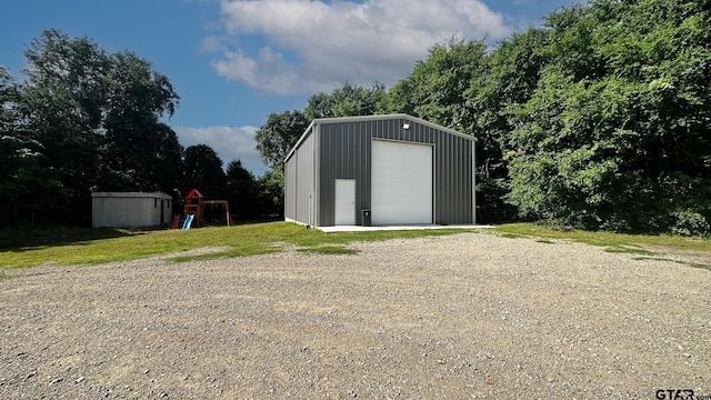 view of outdoor structure featuring a garage