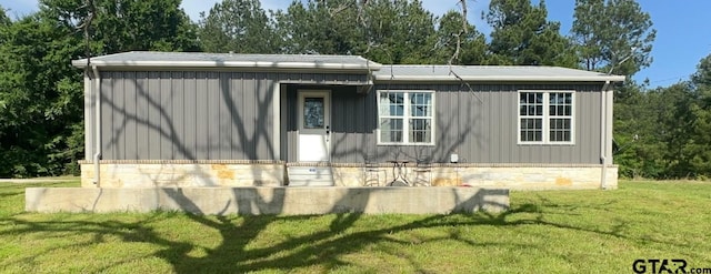 view of home's exterior featuring a lawn