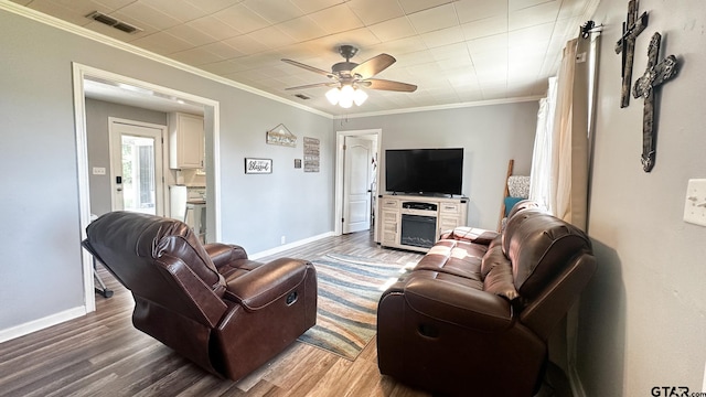 living room with ceiling fan, wood-type flooring, and ornamental molding