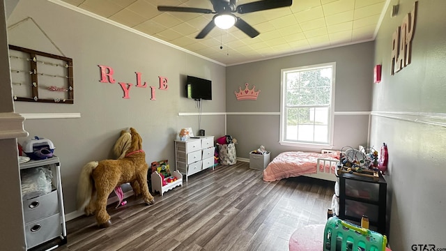 bedroom with ornamental molding, hardwood / wood-style floors, and ceiling fan