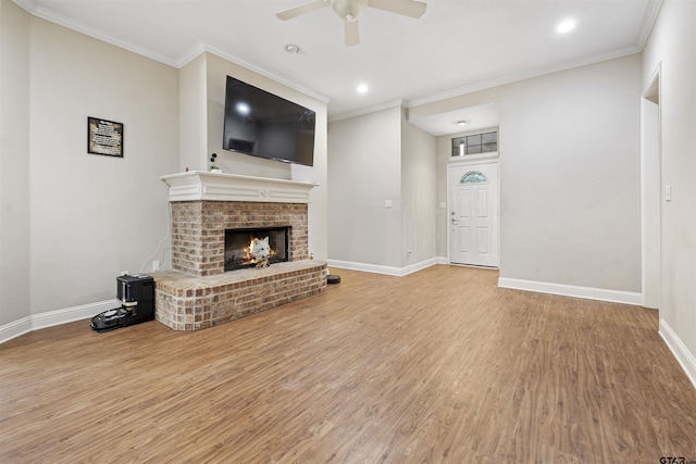 18313 Highmeadow Cir, Flint, TX 75762 - unfurnished living room with wood finished floors, ceiling fan, baseboards, a fireplace, and ornamental molding
