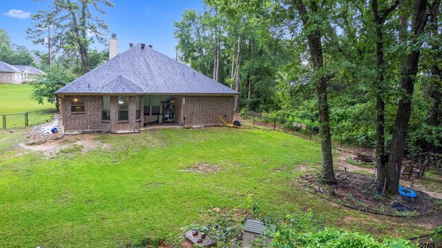 18313 Highmeadow Cir, Flint, TX 75762 - rear view of house featuring a chimney and brick siding