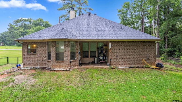 18313 Highmeadow Cir, Flint, TX 75762 - rear view of house featuring brick siding, a shingled roof, and a chimney