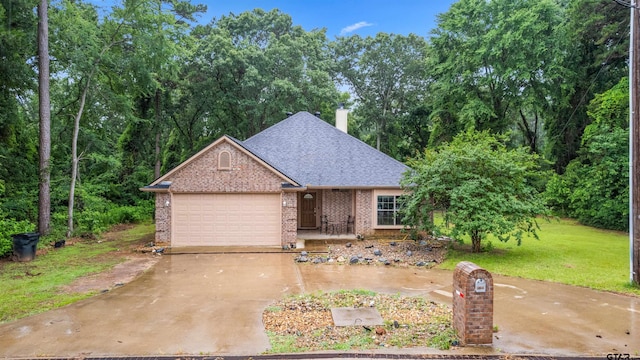 18313 Highmeadow Cir, Flint, TX 75762 - view of front of home featuring a shingled roof, an attached garage, brick siding, a chimney, and concrete driveway