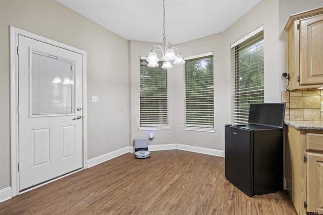 18313 Highmeadow Cir, Flint, TX 75762 - dining area with light wood-type flooring, a chandelier, and baseboards