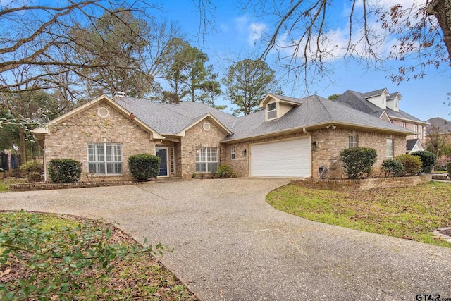 660 Bunker Dr, Tyler, TX 75703 - traditional-style house with brick siding, driveway, an attached garage, and a shingled roof