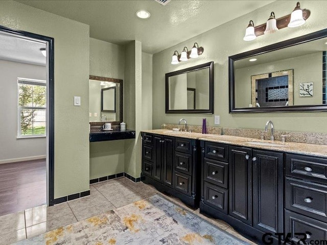 bathroom featuring vanity and tile patterned flooring