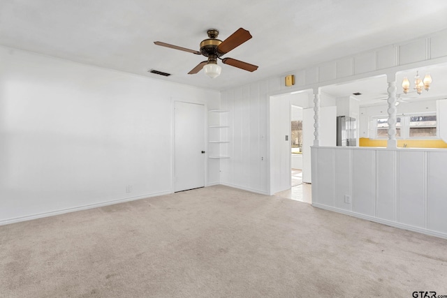 2444 Sunnybrook Dr, Tyler, TX 75701 - empty room with ceiling fan with notable chandelier and light carpet