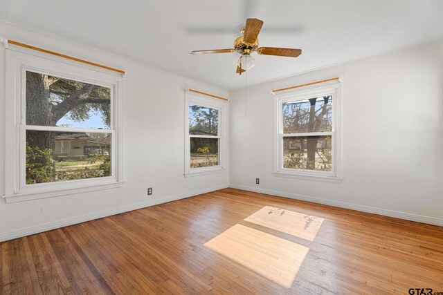 2444 Sunnybrook Dr, Tyler, TX 75701 - empty room with ceiling fan, light hardwood / wood-style flooring, and a wealth of natural light