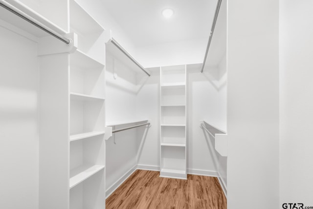 walk in closet featuring light wood-type flooring