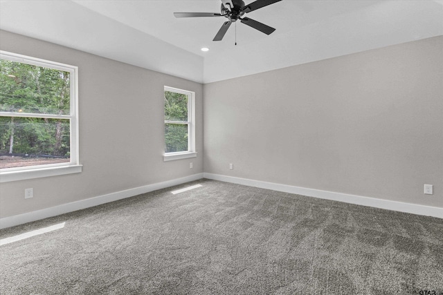 carpeted empty room featuring ceiling fan