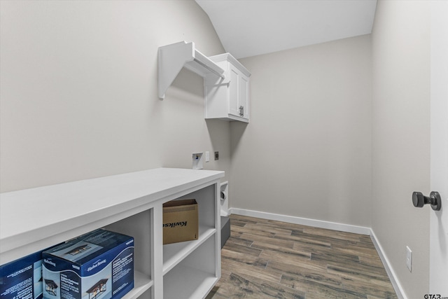 laundry area with dark hardwood / wood-style flooring, cabinets, and electric dryer hookup