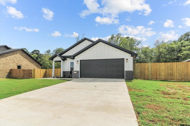 view of front of house with a front lawn and a garage