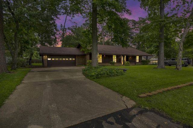 10462 County Road 1265, Flint, TX 75762 - single story home featuring concrete driveway, a lawn, and an attached garage