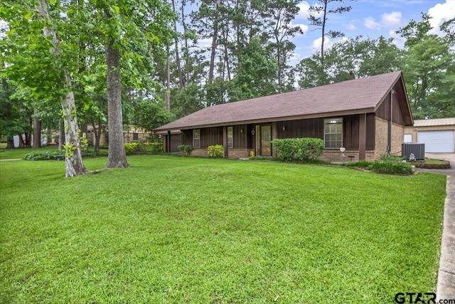 10462 County Road 1265, Flint, TX 75762 - ranch-style home featuring central air condition unit, a front lawn, brick siding, a garage, and roof with shingles