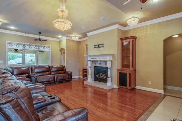 3072 Yasmeen Cir, Flint, TX 75762 - tiled living area featuring arched walkways, a ceiling fan, a tile fireplace, baseboards, and recessed lighting