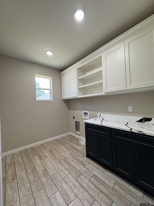 18268 US Jones Dr, Tyler, TX 75705 - laundry room featuring cabinet space, hookup for a washing machine, hookup for an electric dryer, light wood-style flooring, and recessed lighting