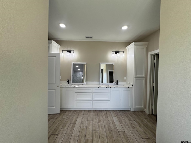 18268 US Jones Dr, Tyler, TX 75705 - full bathroom with double vanity, wood finished floors, and recessed lighting