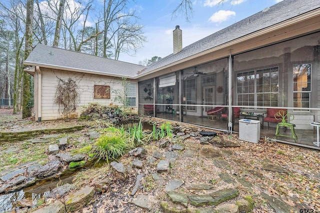 rear view of house with a sunroom