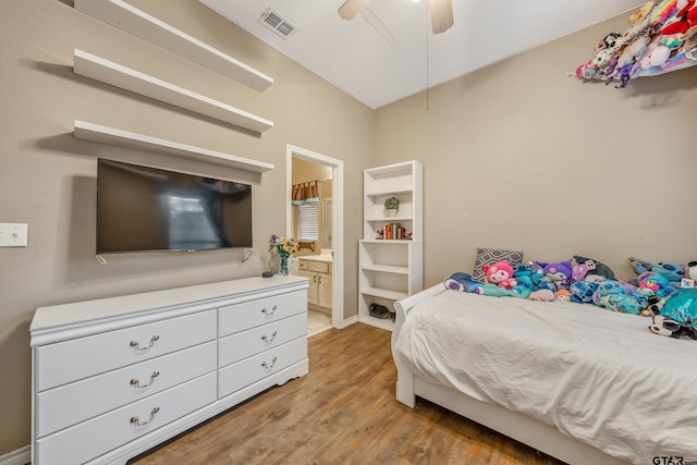 bedroom featuring ensuite bathroom, ceiling fan, and light hardwood / wood-style floors