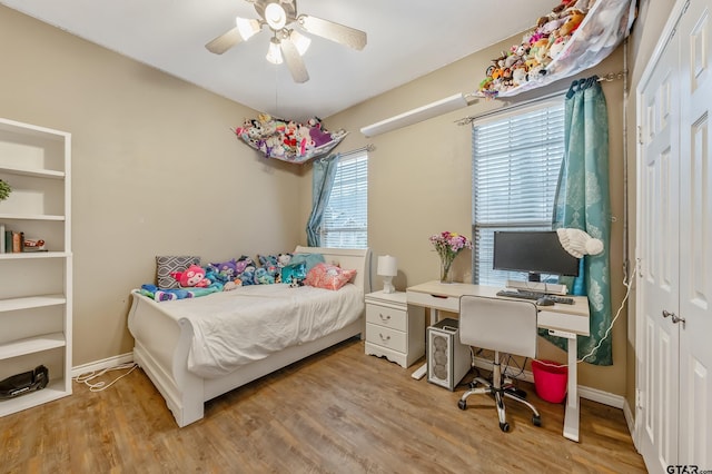 bedroom featuring ceiling fan and hardwood / wood-style floors