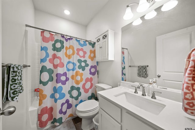 full bathroom with vanity, toilet, shower / bathtub combination with curtain, and hardwood / wood-style flooring